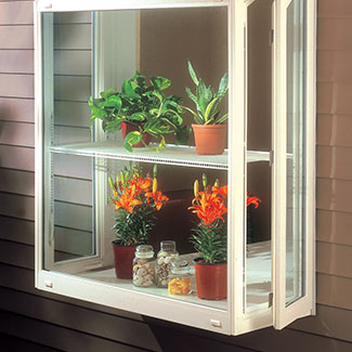 Garden window with potted plants.